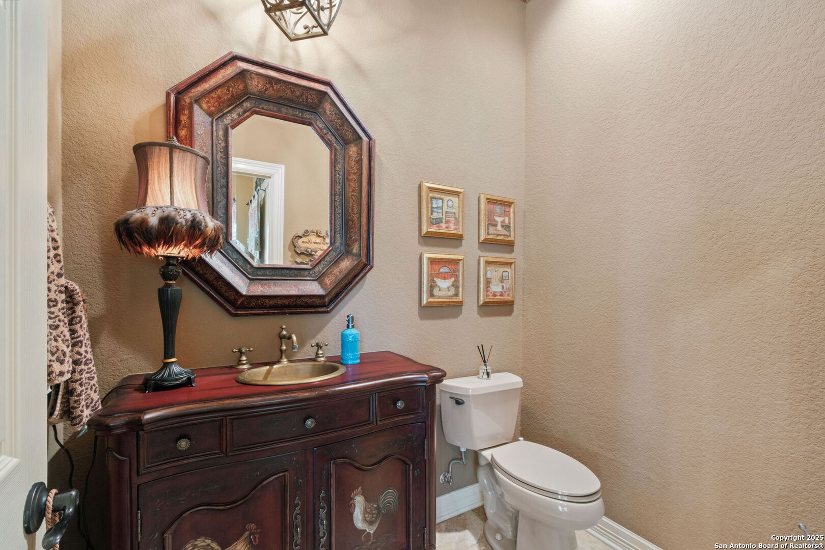 325 Whitestone Drive Spring Branch, TX 78070 - Photo 33 of 50 a bathroom with a toilet a sink and mirror