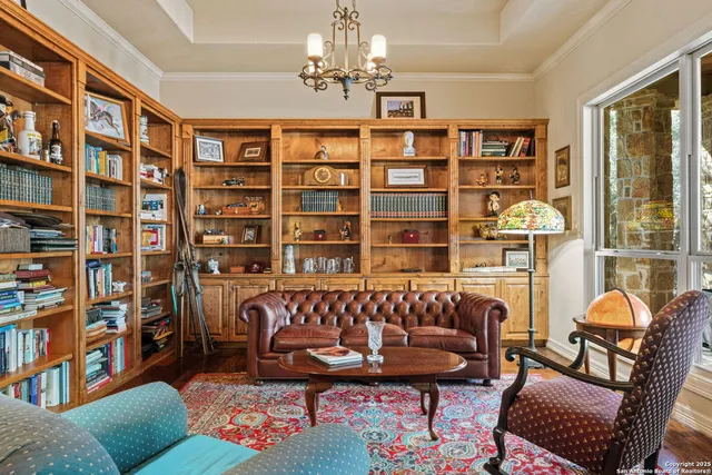 a lobby with furniture and large windows