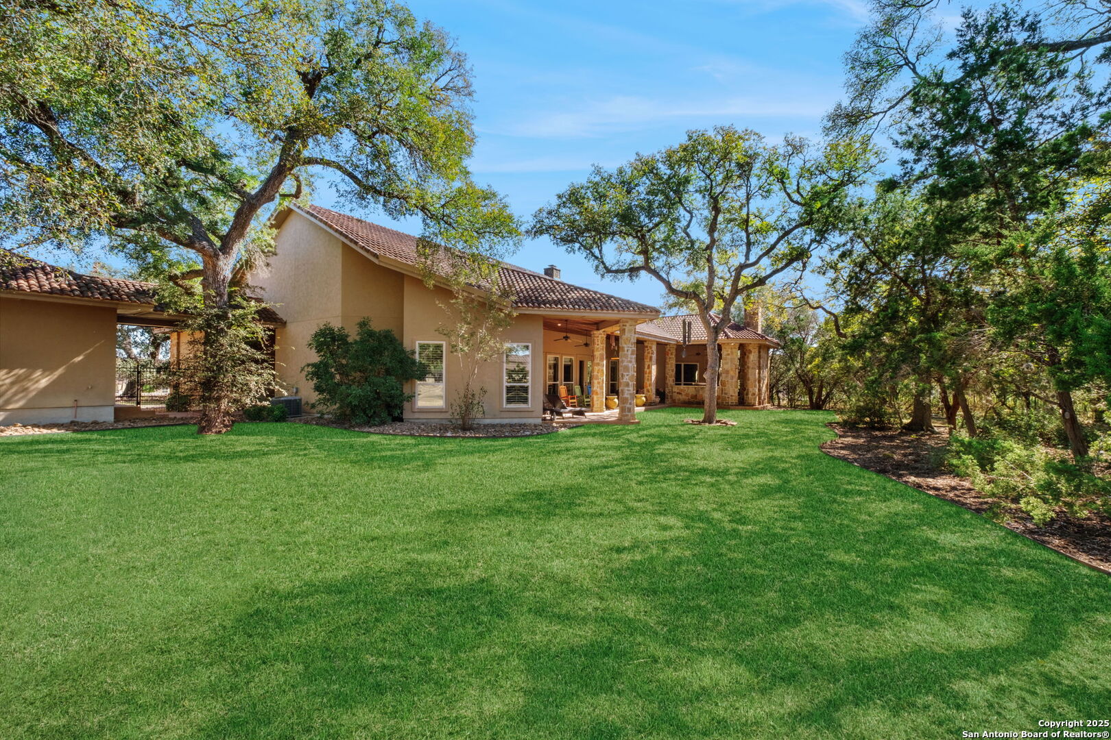 325 Whitestone Drive Spring Branch, TX 78070 - Photo 41 of 50 a view of a house with backyard and garden
