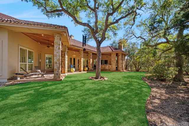a living room with furniture a fireplace and a table