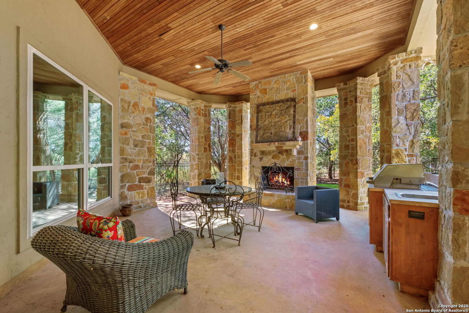 325 Whitestone Drive Spring Branch, TX 78070 - Photo 44 of 50 a living room with furniture a fireplace and a table