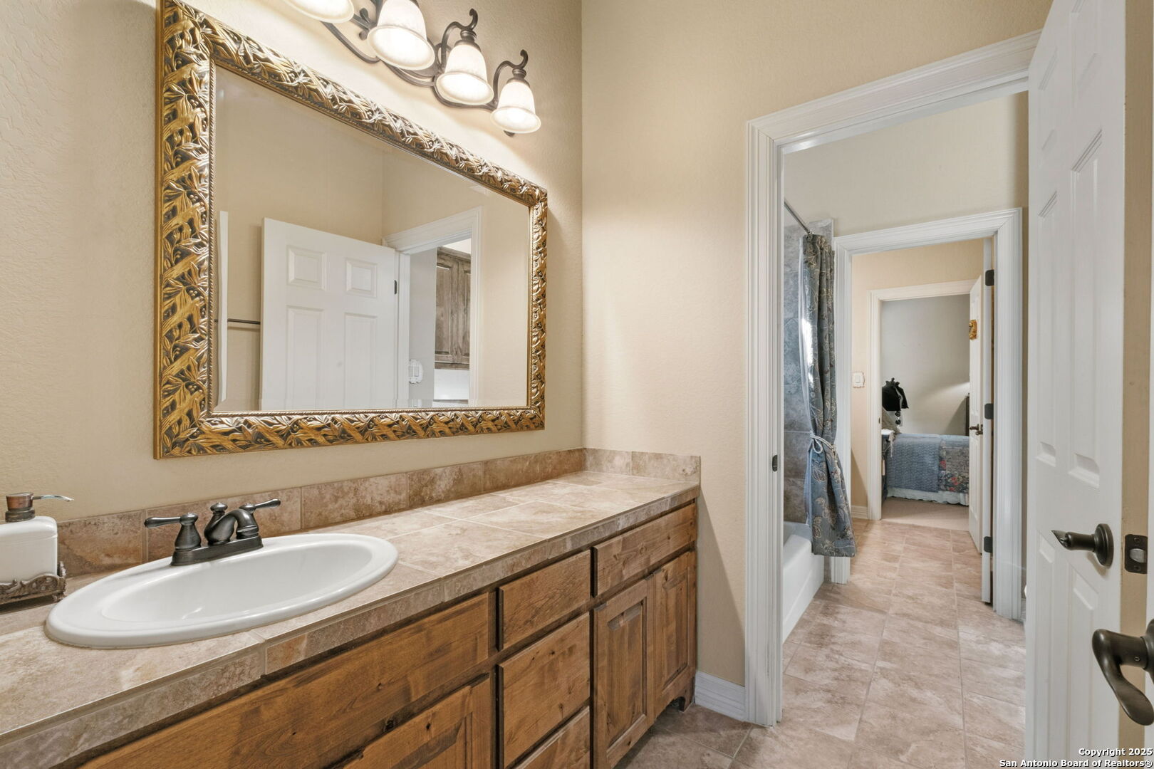 325 Whitestone Drive Spring Branch, TX 78070 - Photo 9 of 50 a bathroom with a granite countertop sink mirror and a