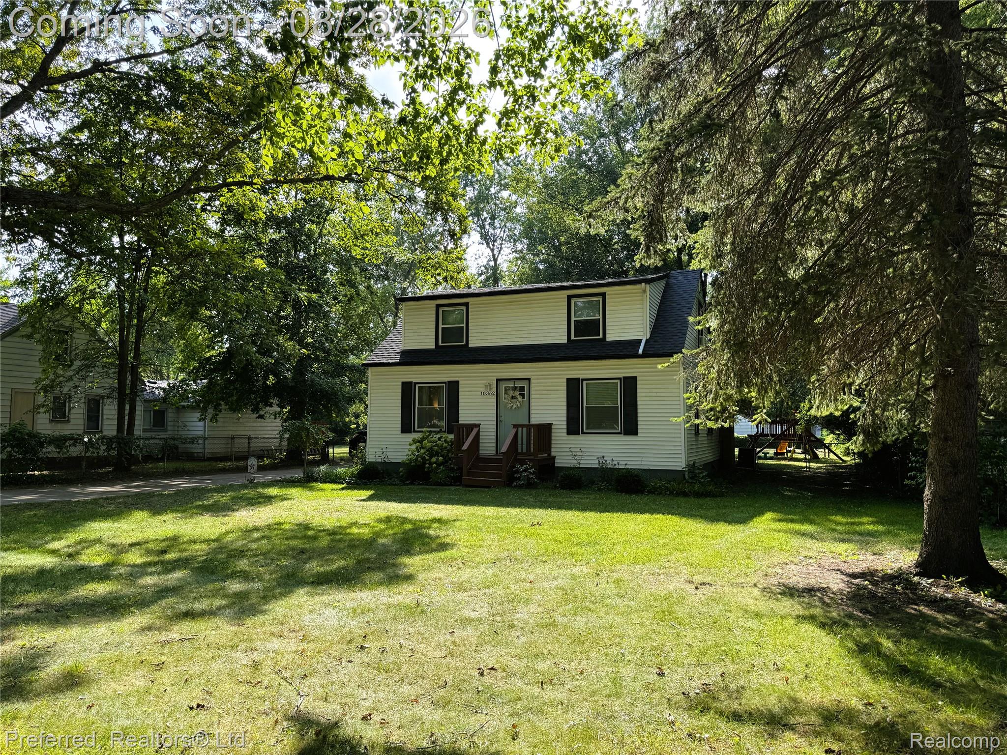 10362 Quirk Road Belleville, MI 48111 - Photo 2 of 41 Two-story residence with white siding and a dark shingle roof on just under a half acre!