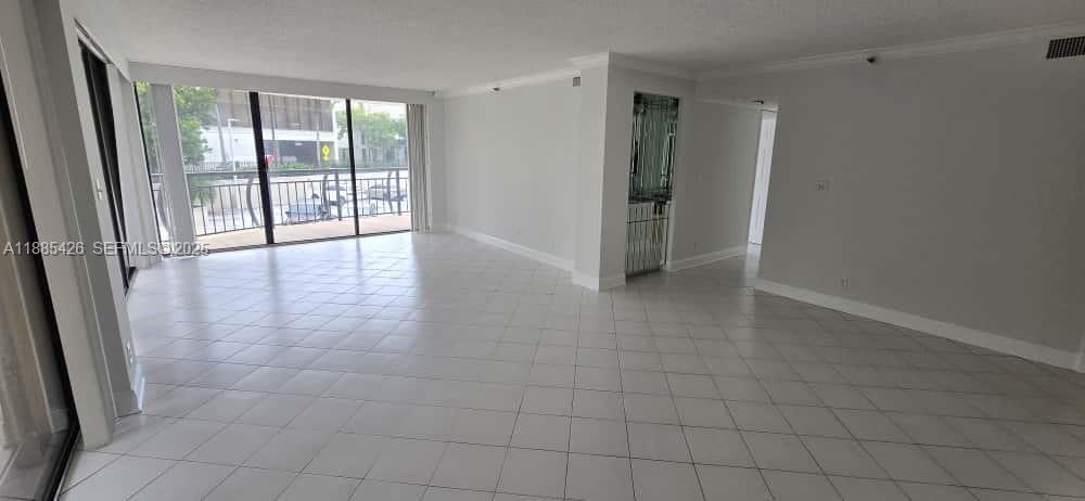 2843 South Bayshore Drive, Unit 3A Miami, FL 33133 - Photo 15 of 43 an empty room with entrance and windows