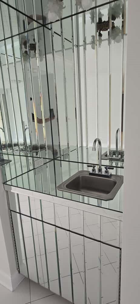 2843 South Bayshore Drive, Unit 3A Miami, FL 33133 - Photo 19 of 43 a bathroom with a sink and a mirror
