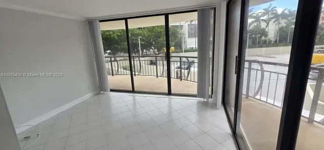 a view of empty room with sliding door