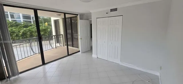 a view of empty room with sliding door