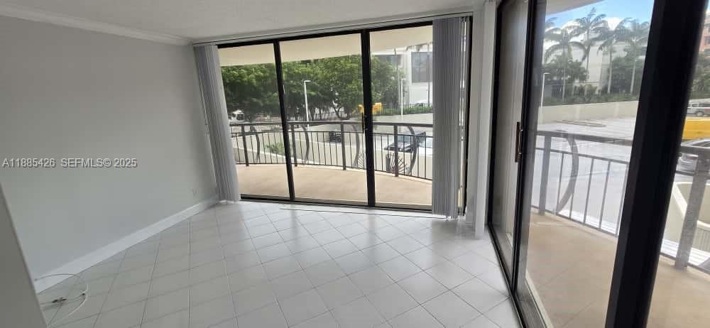 2843 South Bayshore Drive, Unit 3A Miami, FL 33133 - Photo 22 of 43 a view of empty room with sliding door