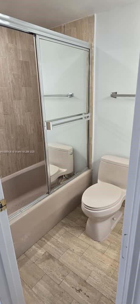 2843 South Bayshore Drive, Unit 3A Miami, FL 33133 - Photo 23 of 43 a white toilet sitting next to a bath tub