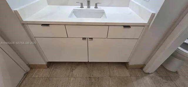 a bathroom with a bathtub and a sink