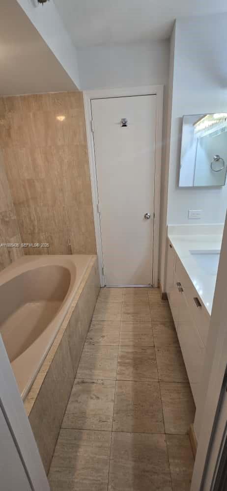 2843 South Bayshore Drive, Unit 3A Miami, FL 33133 - Photo 35 of 43 a bathroom with a bathtub and a sink