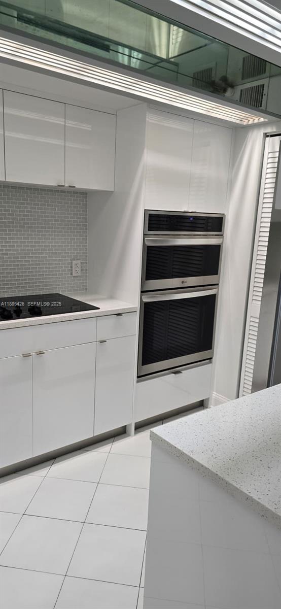 2843 South Bayshore Drive, Unit 3A Miami, FL 33133 - Photo 4 of 43 a view of a kitchen with storage and utility room