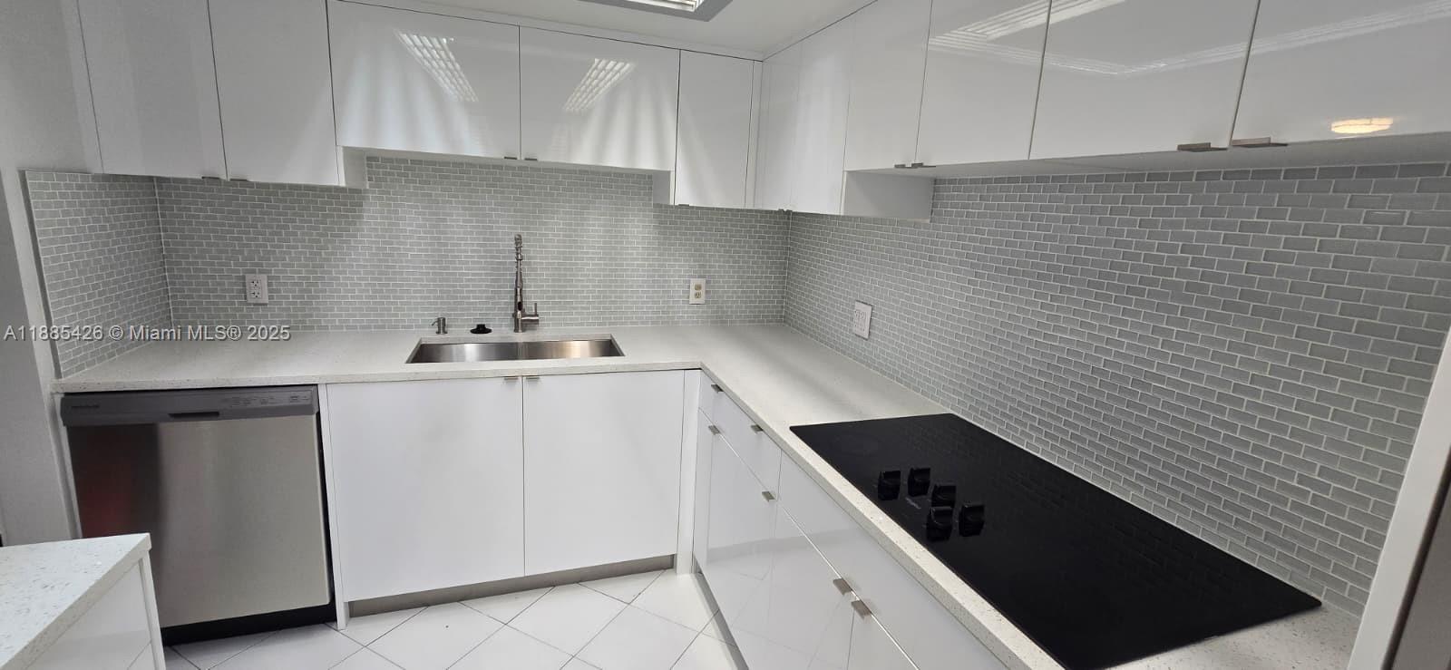 2843 South Bayshore Drive, Unit 3A Miami, FL 33133 - Photo 7 of 43 a kitchen with a sink and cabinets