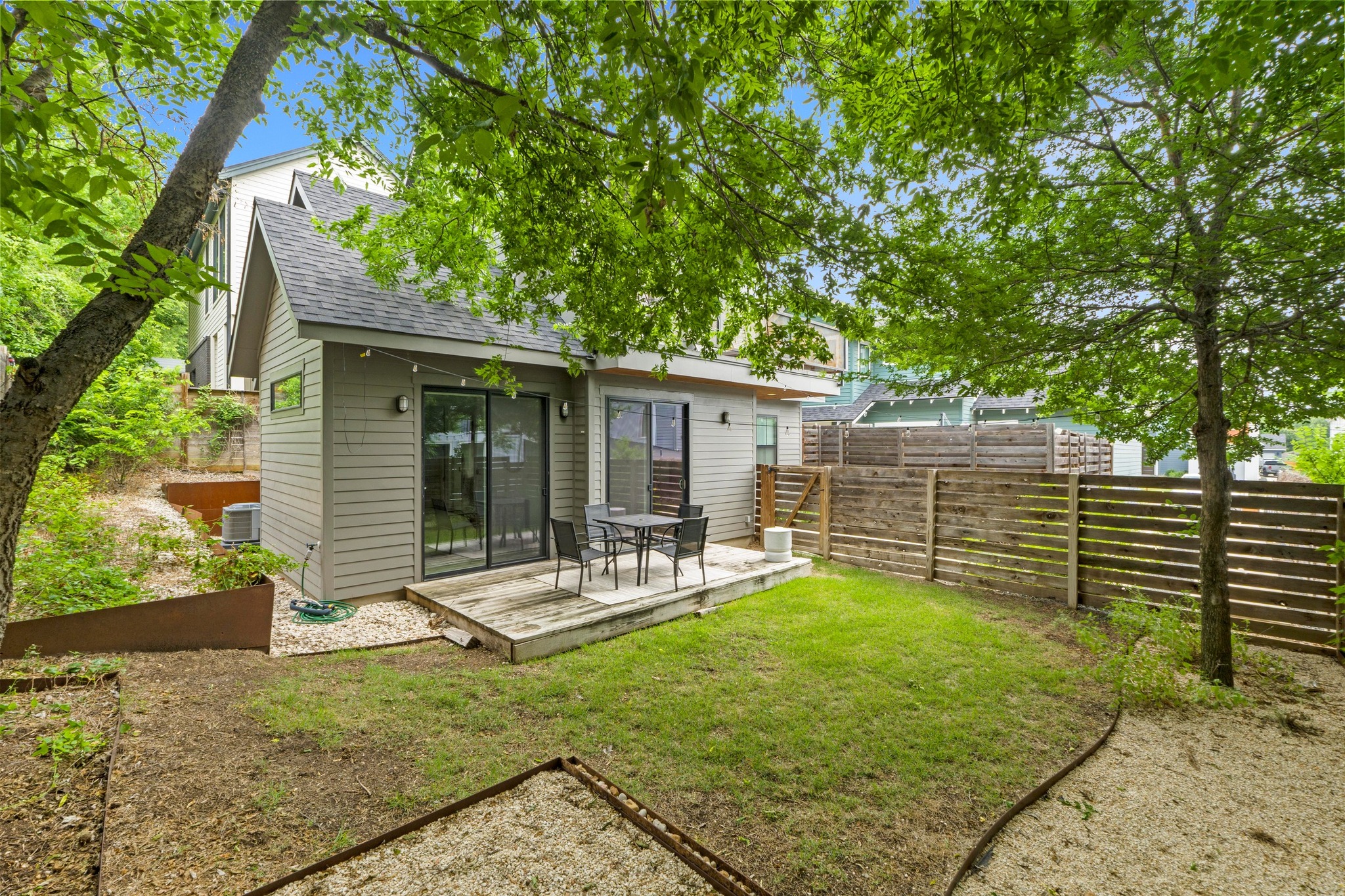 1706 Perez Street, Unit 2 Austin, TX 78721 - Photo 28 of 29 A tranquil backyard retreat awaits, complete with a private deck and verdant surroundings.