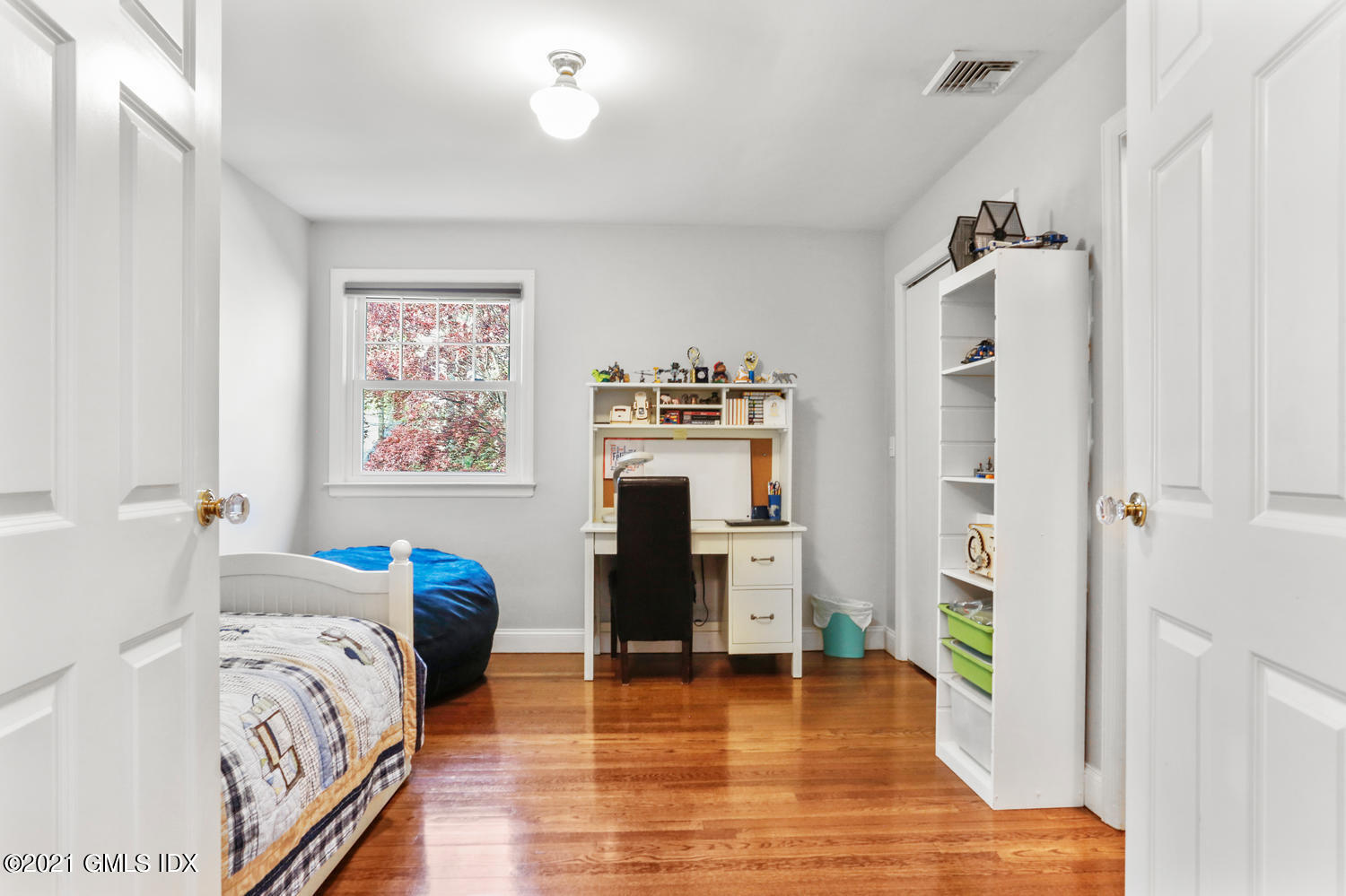 6 Palmer Terrace Riverside, CT 06878 - Photo 14 of 24 a bedroom with a bed and a wooden floor