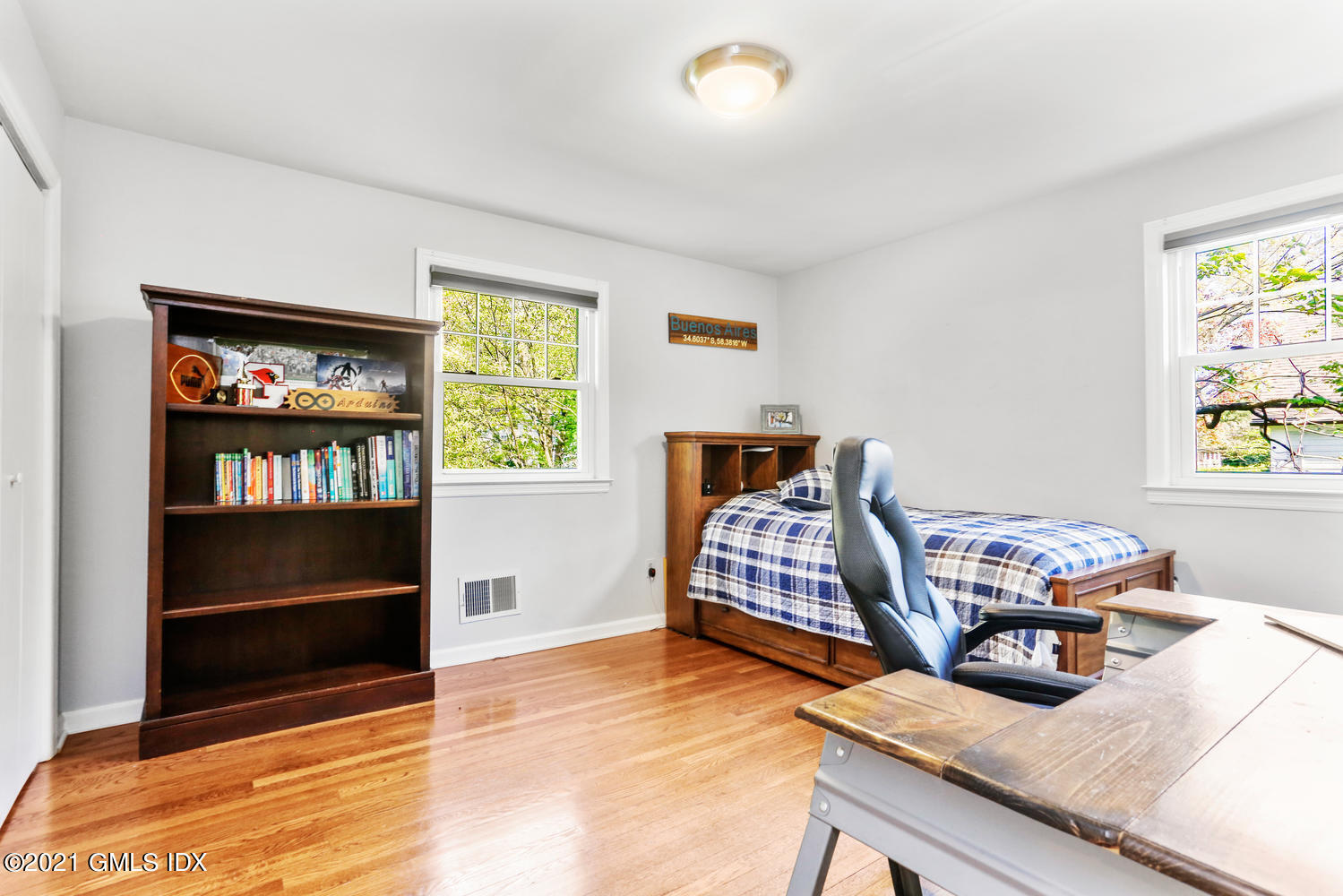 6 Palmer Terrace Riverside, CT 06878 - Photo 15 of 24 a bedroom with furniture and a book shelf