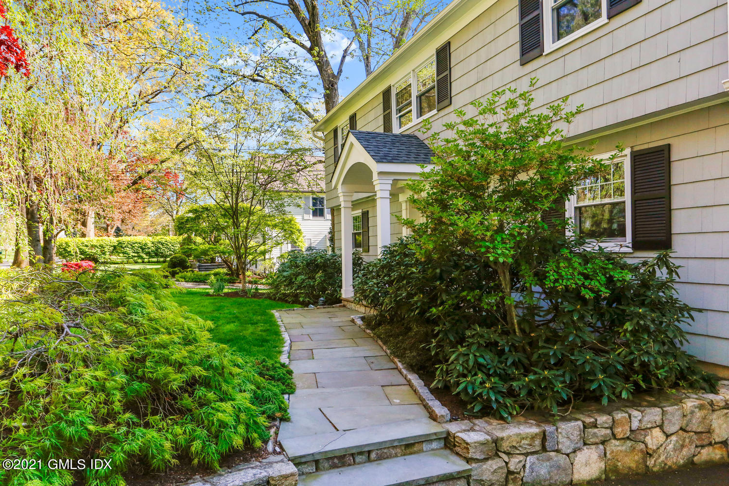 6 Palmer Terrace Riverside, CT 06878 - Photo 2 of 24 a view of a pathway with flower plants