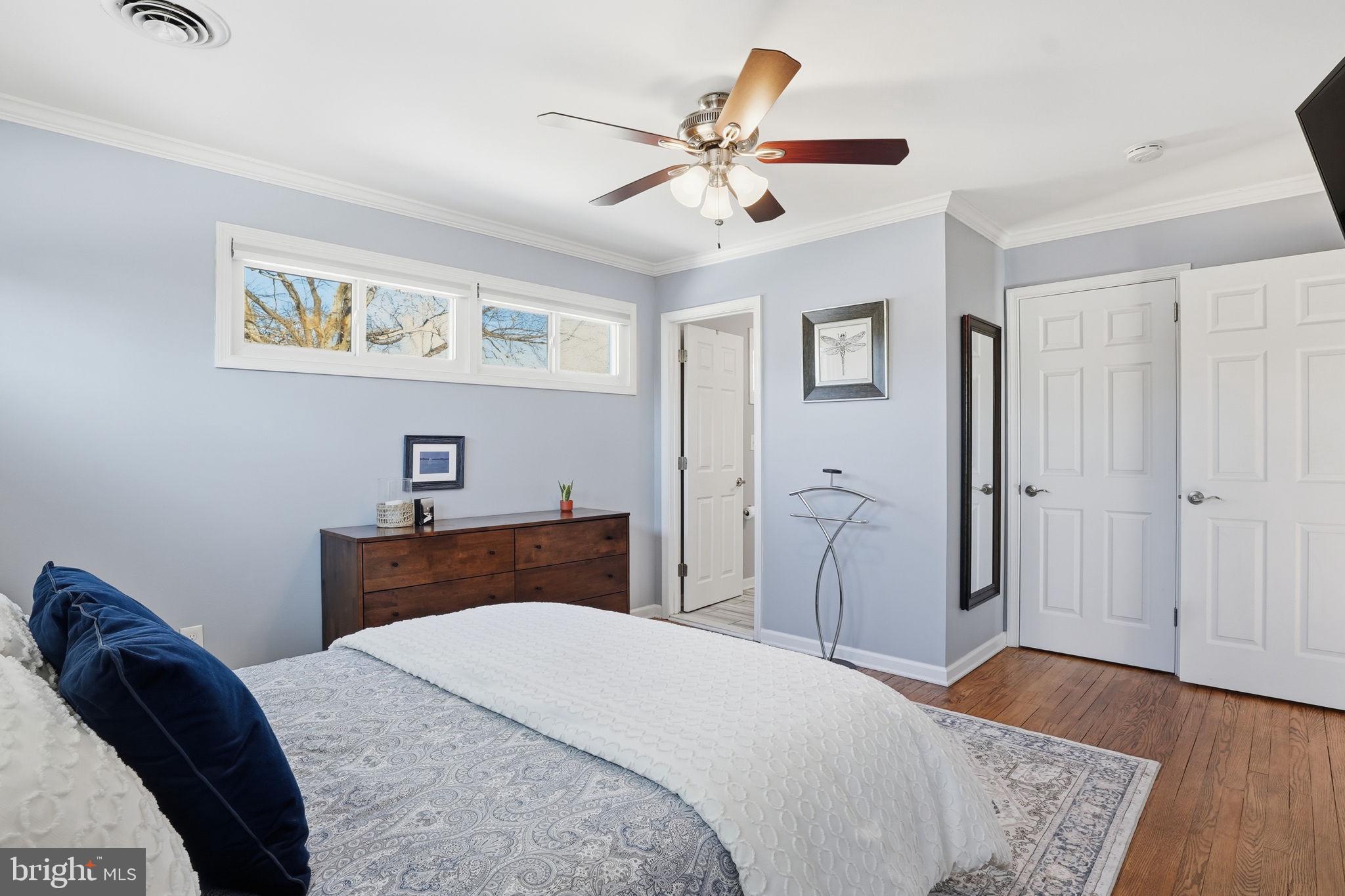 19 Williams Drive Annapolis, MD 21401 - Photo 22 of 45 a bedroom with a bed and wooden floor
