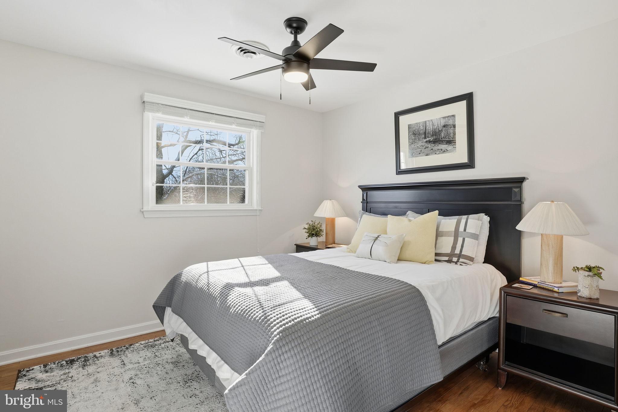 19 Williams Drive Annapolis, MD 21401 - Photo 24 of 45 a bedroom with bed and a chandelier