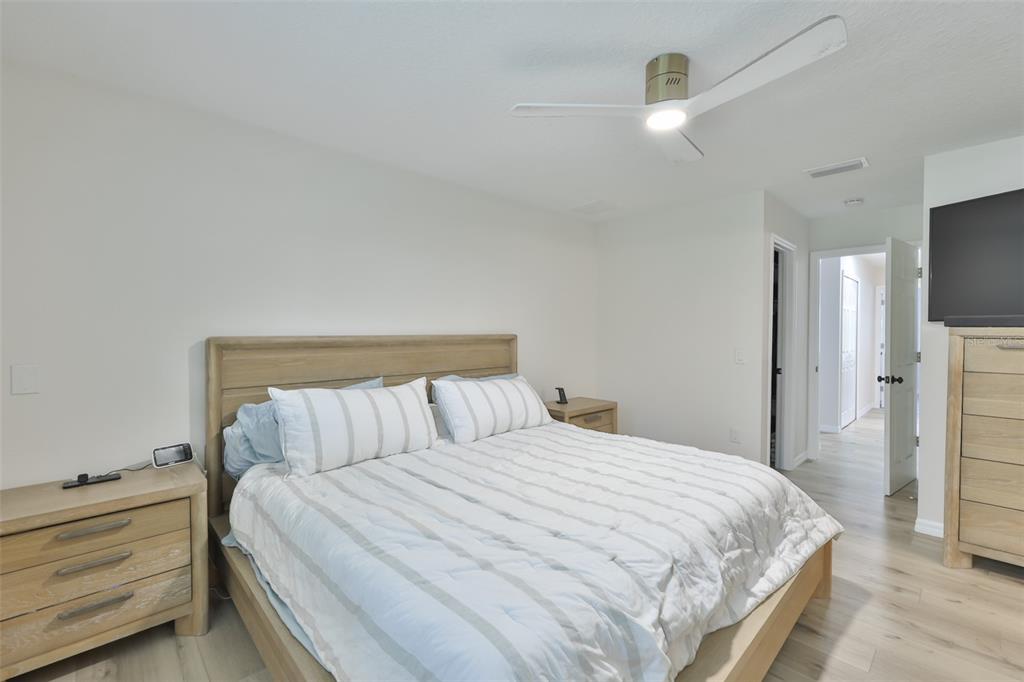 1578 Indian Bay Road Spring Hill, FL 34607 - Photo 26 of 51 a bedroom with a bed and a flat screen tv