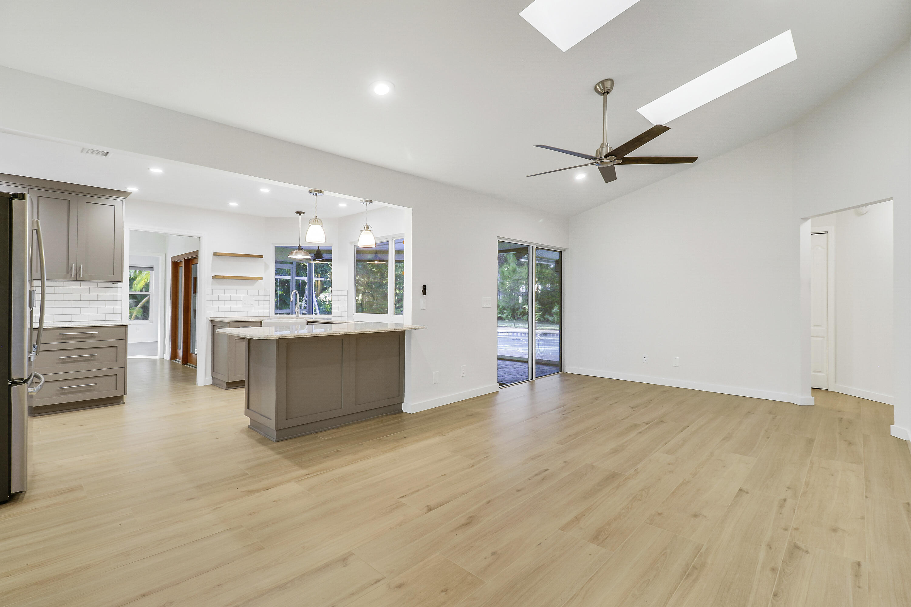 5775 Set-N-Sun Place Jupiter, FL 33458 - Photo 14 of 54 a view of a kitchen with a sink and a window