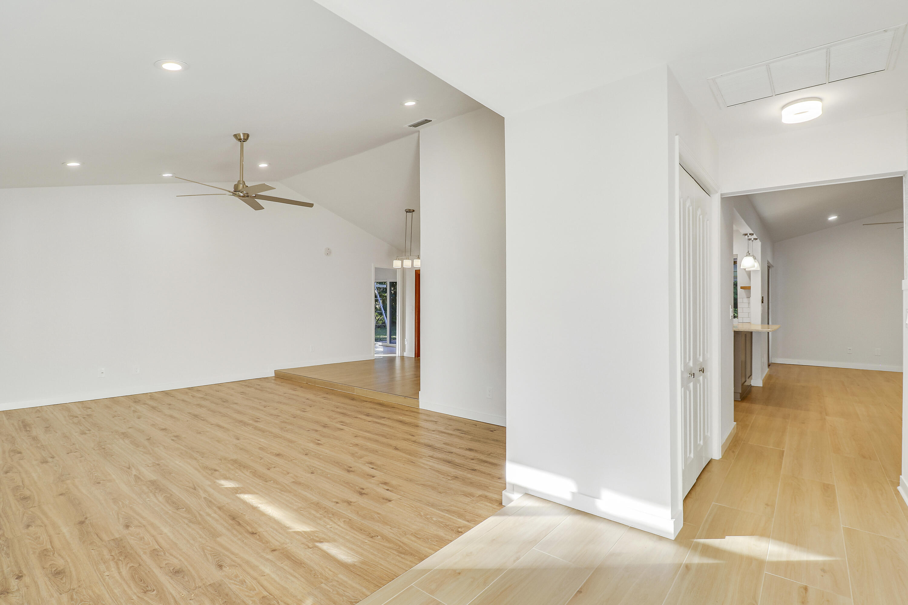 5775 Set-N-Sun Place Jupiter, FL 33458 - Photo 20 of 54 a view of a big room with wooden floor and a bathroom
