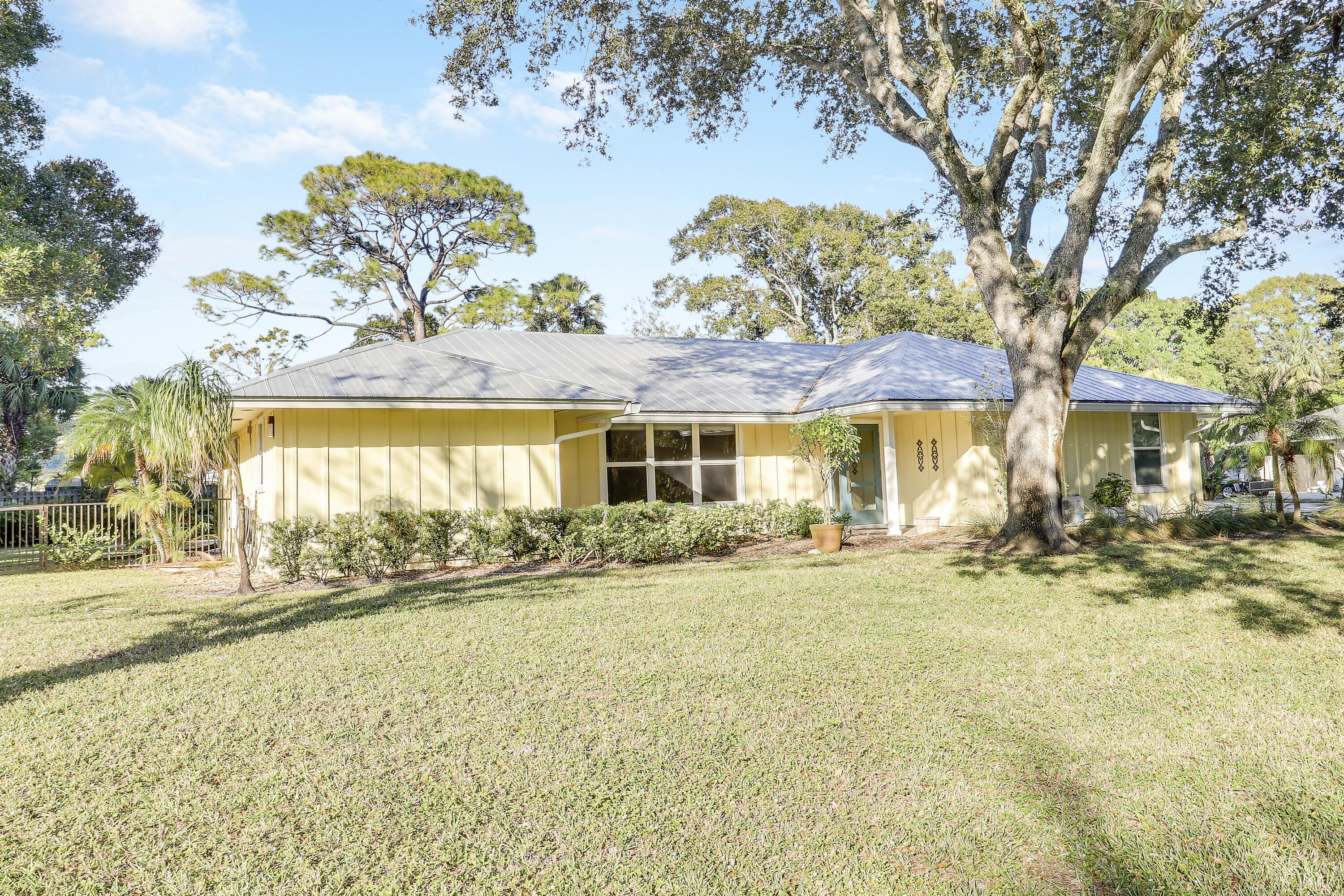 5775 Set-N-Sun Place Jupiter, FL 33458 - Photo 2 of 54 swimming pool with outdoor seating and yard