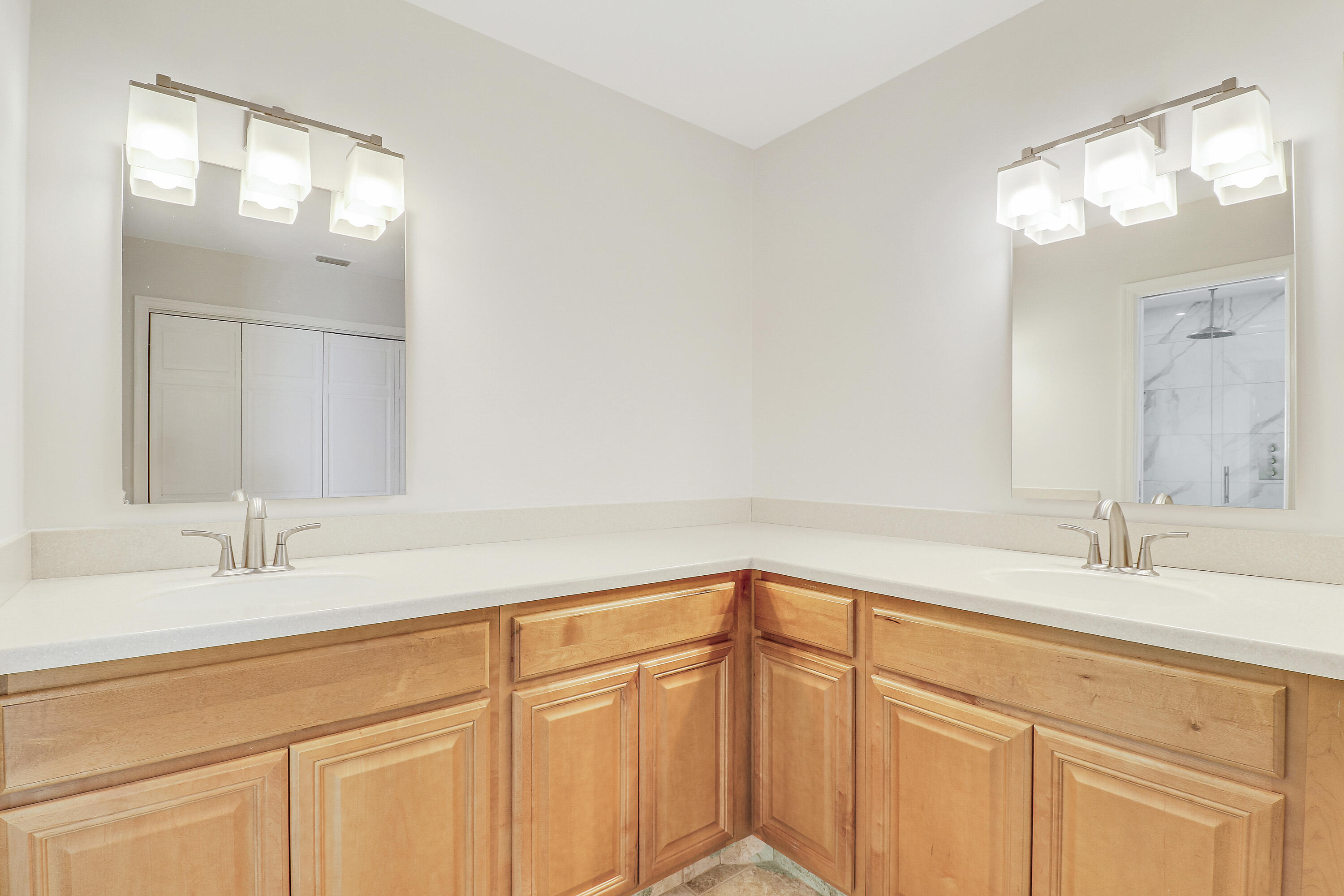 5775 Set-N-Sun Place Jupiter, FL 33458 - Photo 29 of 54 a bathroom with a sink and a mirror