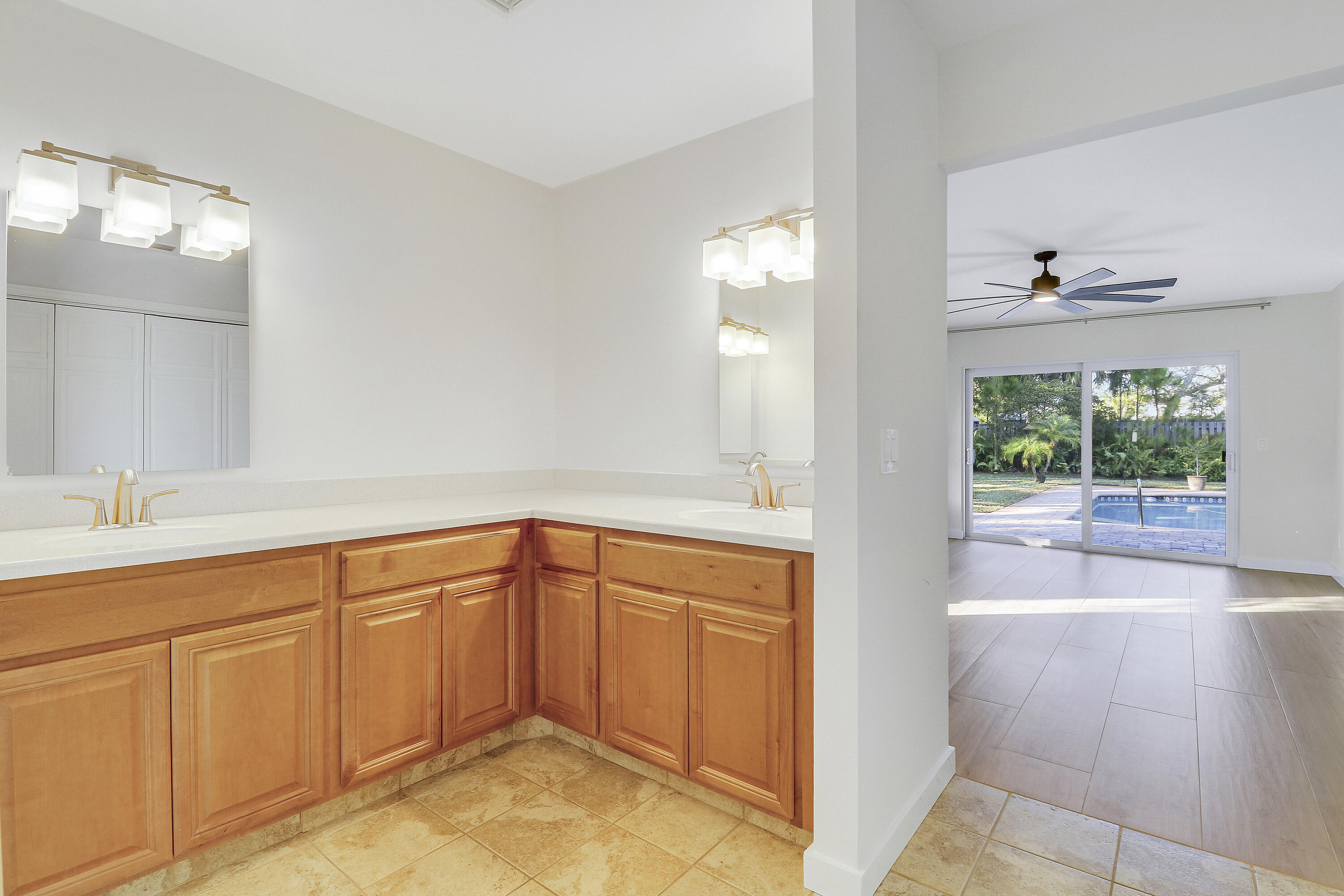 5775 Set-N-Sun Place Jupiter, FL 33458 - Photo 30 of 54 a spacious bathroom with a sink and mirror