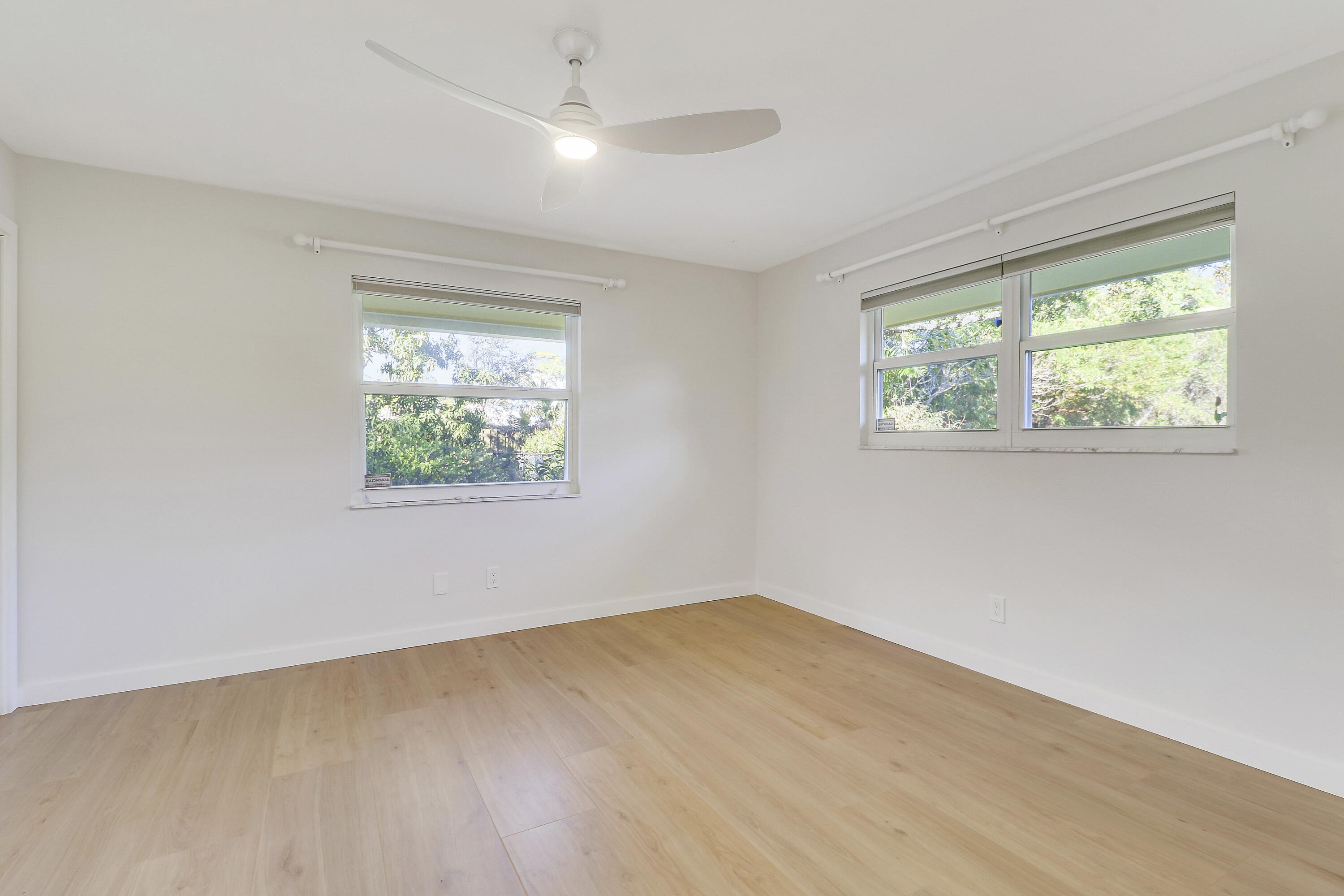 5775 Set-N-Sun Place Jupiter, FL 33458 - Photo 32 of 54 an empty room with a window