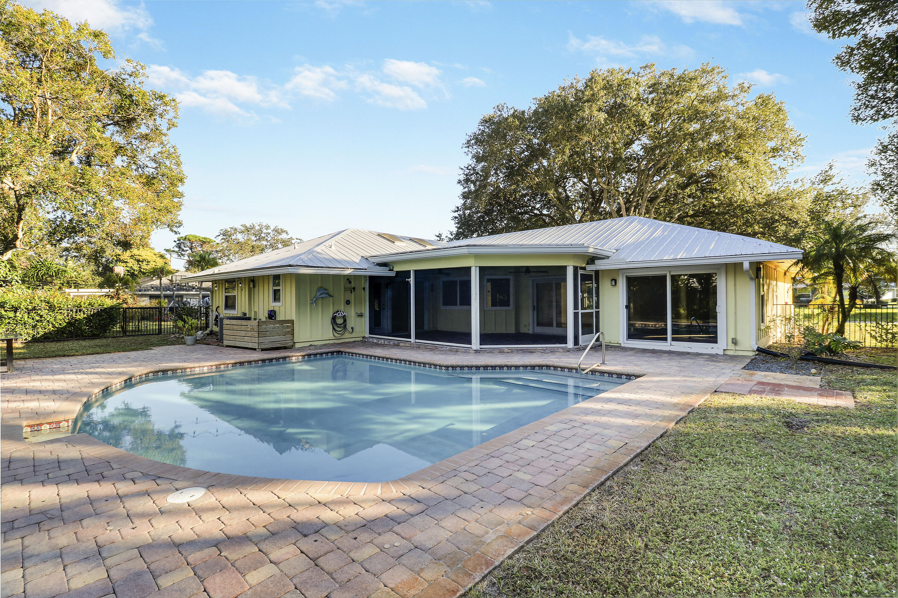 5775 Set-N-Sun Place Jupiter, FL 33458 - Photo 44 of 54 a view of a house with swimming pool and a yard