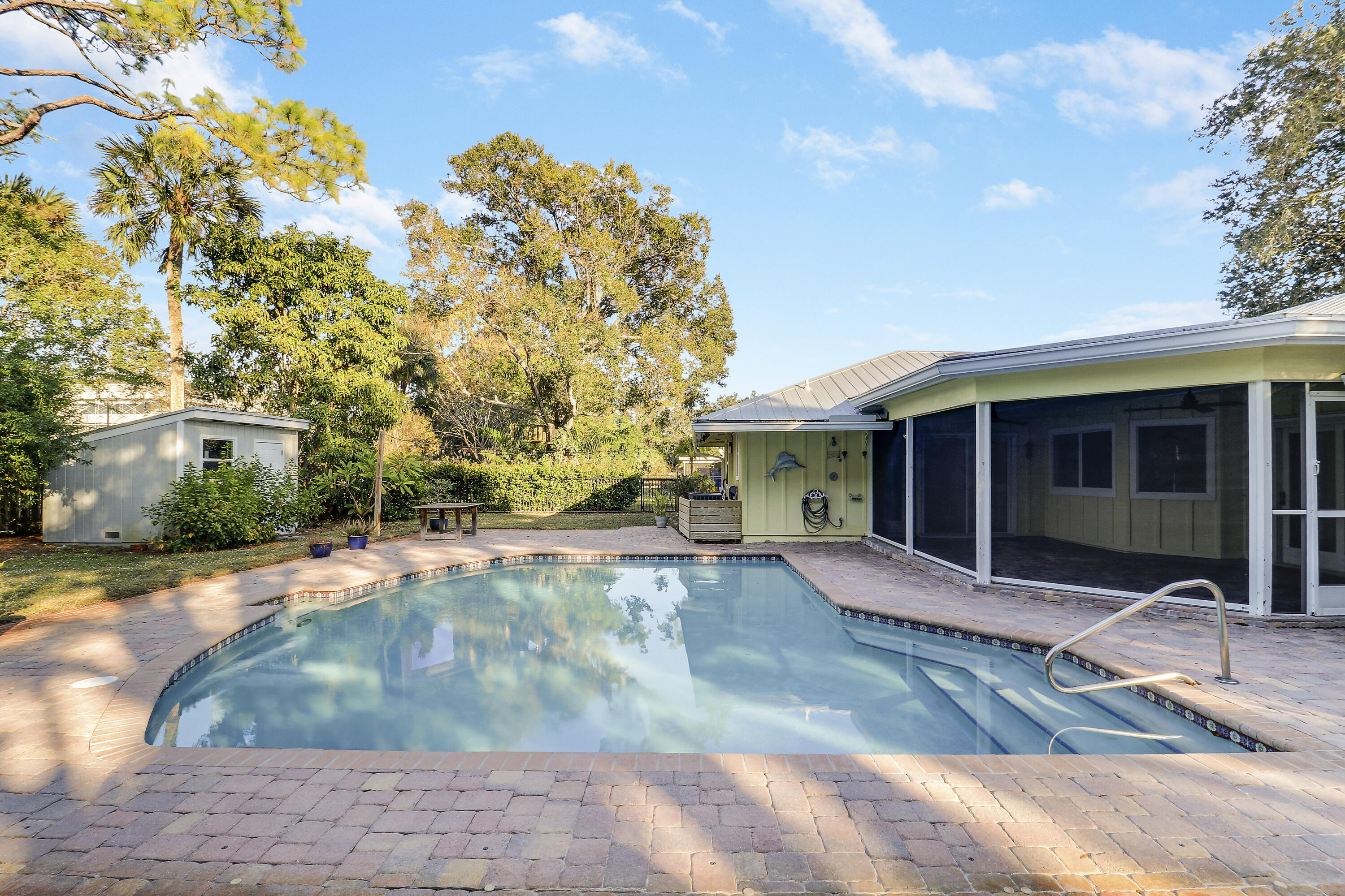 5775 Set-N-Sun Place Jupiter, FL 33458 - Photo 46 of 54 a front view of a house with garden