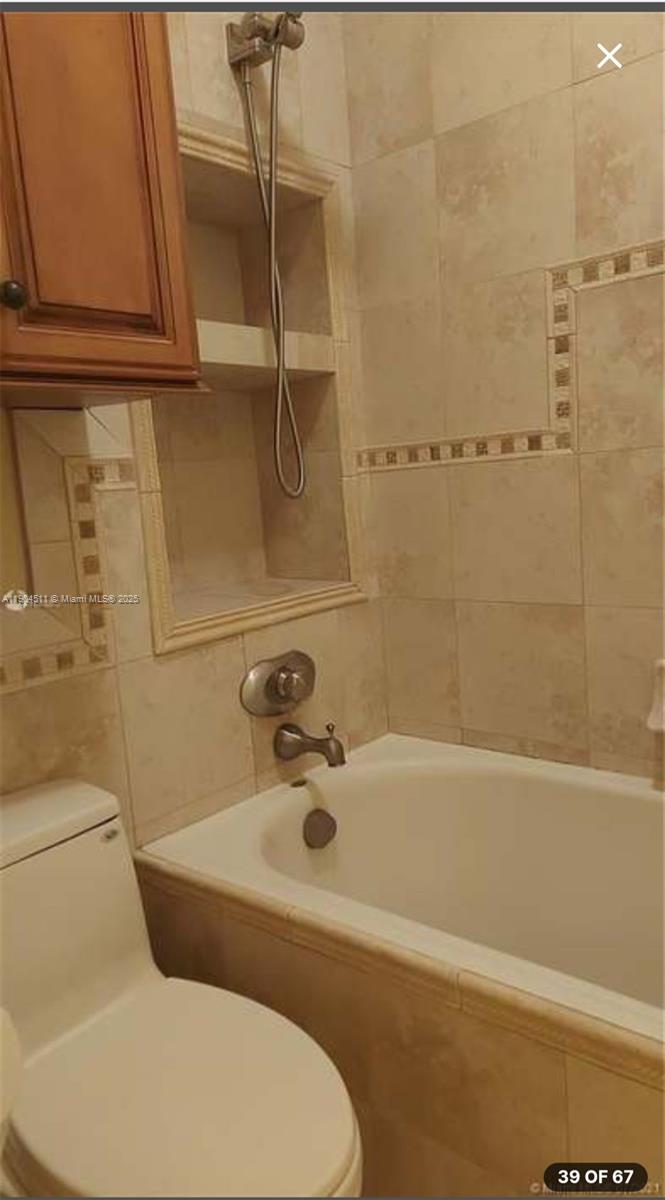 4045 Southwest 151st Terrace Miramar, FL 33027 - Photo 20 of 29 a bathroom with a sink and bathtub