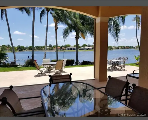 a view of a outdoor sitting area with furniture
