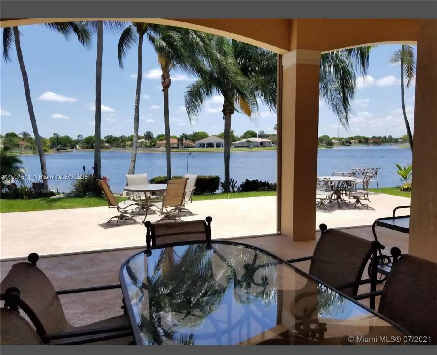 4045 Southwest 151st Terrace Miramar, FL 33027 - Photo 22 of 29 a living room with furniture and a floor to ceiling window