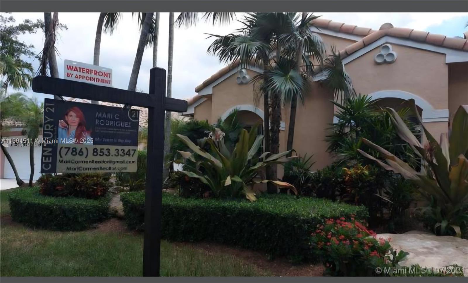 4045 Southwest 151st Terrace Miramar, FL 33027 - Photo 3 of 29 a view of a potted plant with sign board