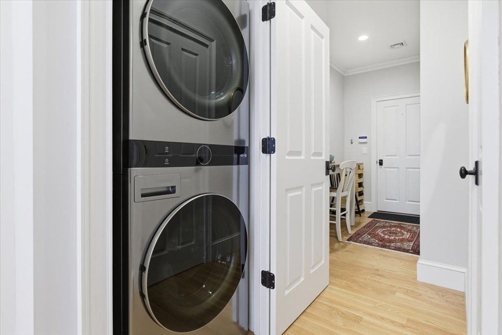 1090 Shore Road, Unit 7 Bourne, MA 02559 - Photo 12 of 42 a view of a hallway with washer and dryer