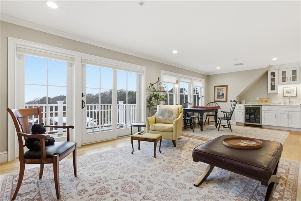 1090 Shore Road, Unit 7 Bourne, MA 02559 - Photo 21 of 42 a living room with furniture and a window