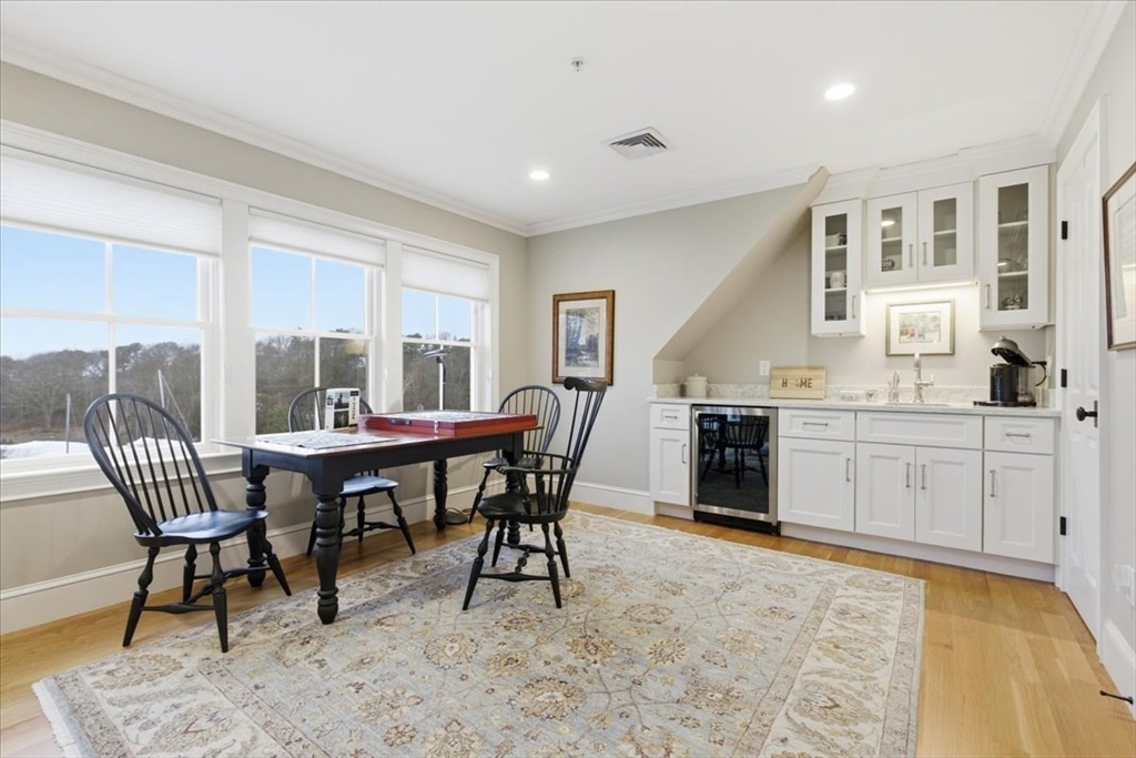 1090 Shore Road, Unit 7 Bourne, MA 02559 - Photo 22 of 42 a open dining room with furniture and window