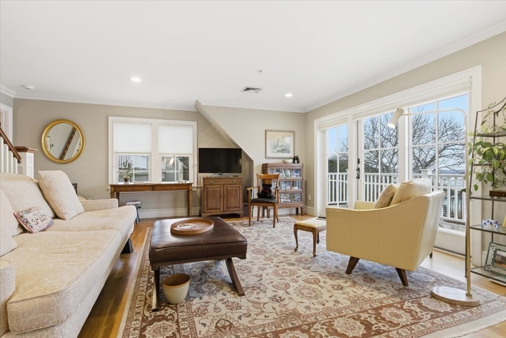 1090 Shore Road, Unit 7 Bourne, MA 02559 - Photo 24 of 42 a living room with furniture and a large window