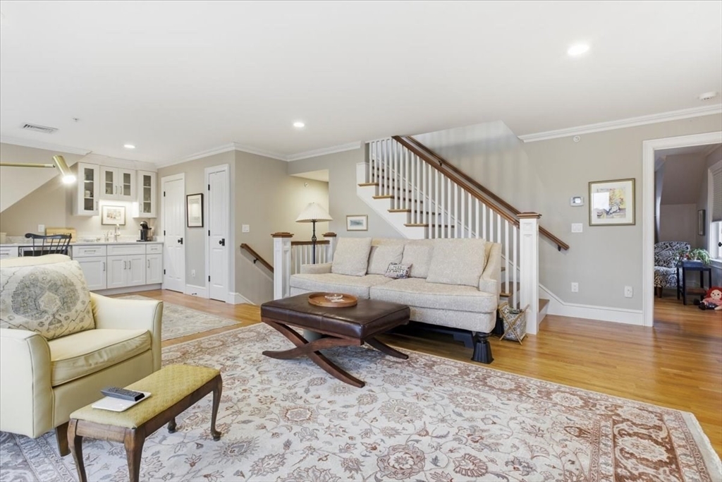 1090 Shore Road, Unit 7 Bourne, MA 02559 - Photo 33 of 42 a living room with furniture and a wooden floor