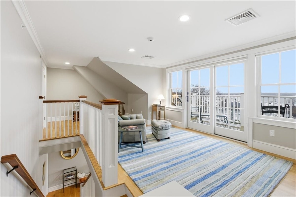 1090 Shore Road, Unit 7 Bourne, MA 02559 - Photo 35 of 42 a living room with furniture and a wooden floor