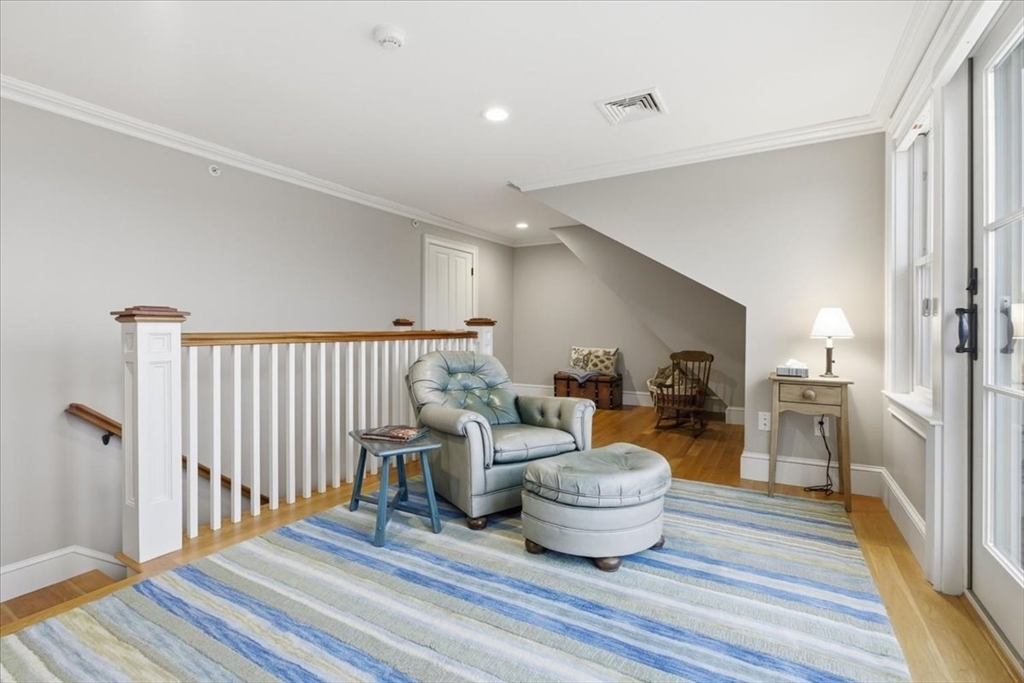 1090 Shore Road, Unit 7 Bourne, MA 02559 - Photo 36 of 42 a living room with furniture and a wooden floor