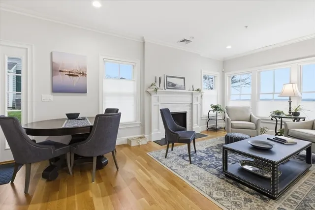 a living room with furniture a table and a fireplace