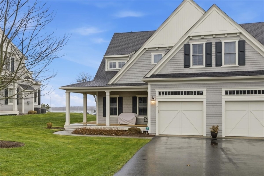 1090 Shore Road, Unit 7 Bourne, MA 02559 - Photo 41 of 42 a front view of a house with a yard