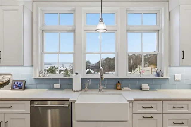 a kitchen with appliances cabinets and a window