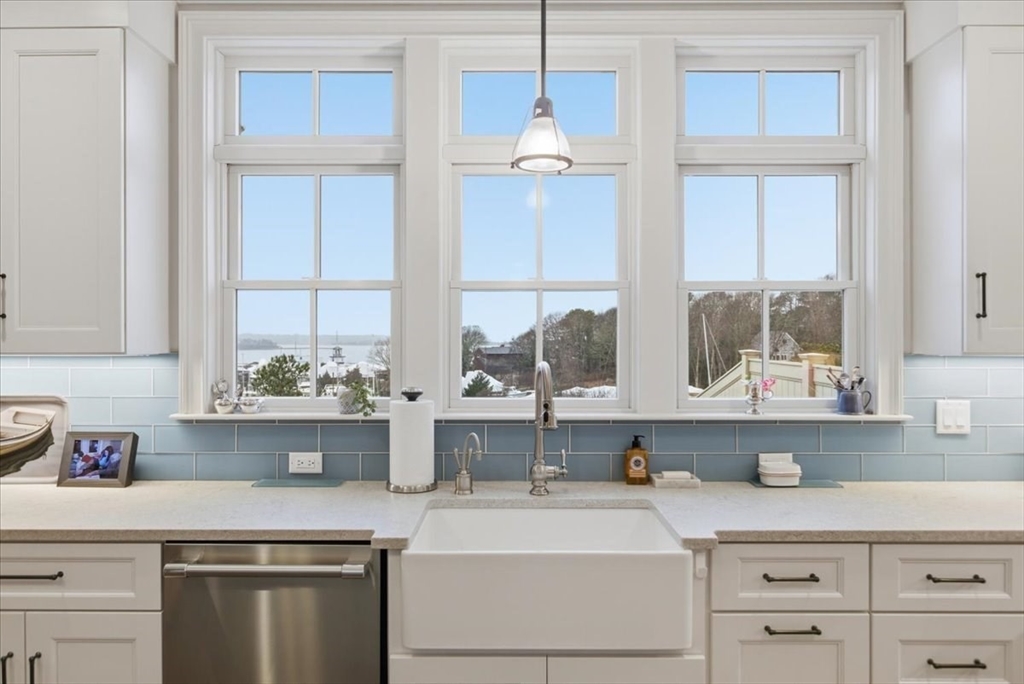 1090 Shore Road, Unit 7 Bourne, MA 02559 - Photo 10 of 42 a kitchen with appliances cabinets and a window