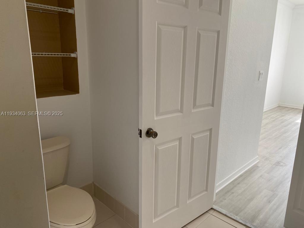 11024 Southwest 237th Lane Homestead, FL 33032 - Photo 16 of 16 a white toilet sitting next to a shower