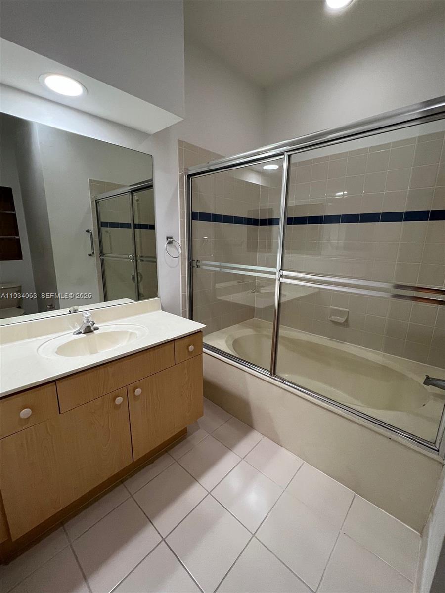 11024 Southwest 237th Lane Homestead, FL 33032 - Photo 3 of 16 a bathroom with a double vanity sink and mirror