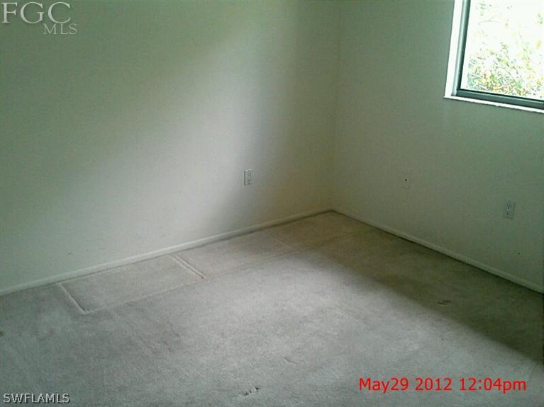 1231 Barrett Road, Unit 1004 North Fort Myers, FL 33903 - Photo 11 of 12 an empty room with a window